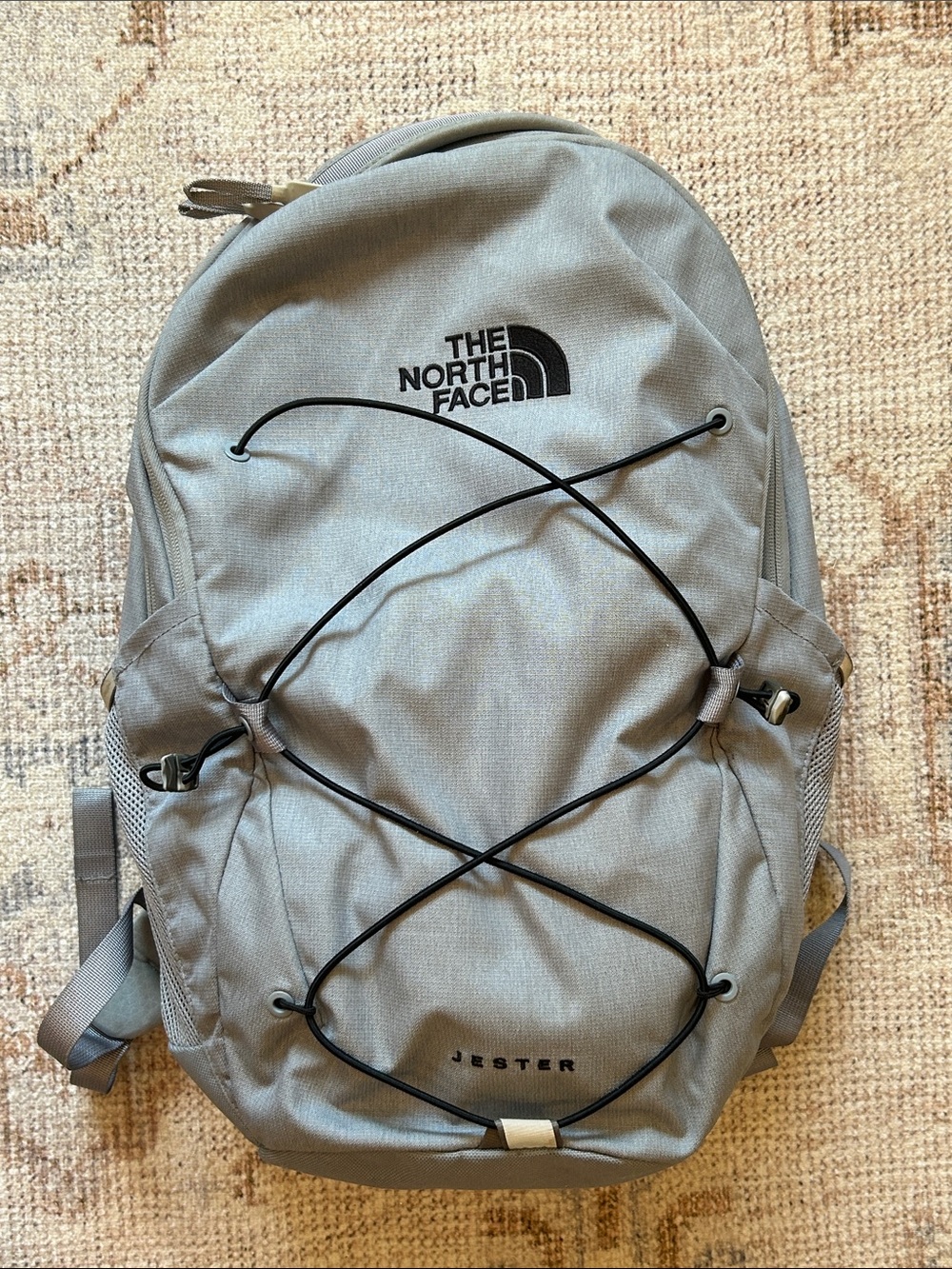 The North Face Jester Backpack in Light Gray with Black Bungee
